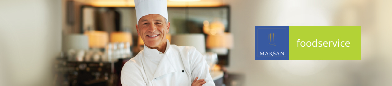 Food Service. Chef with inviting smile in restaurant.